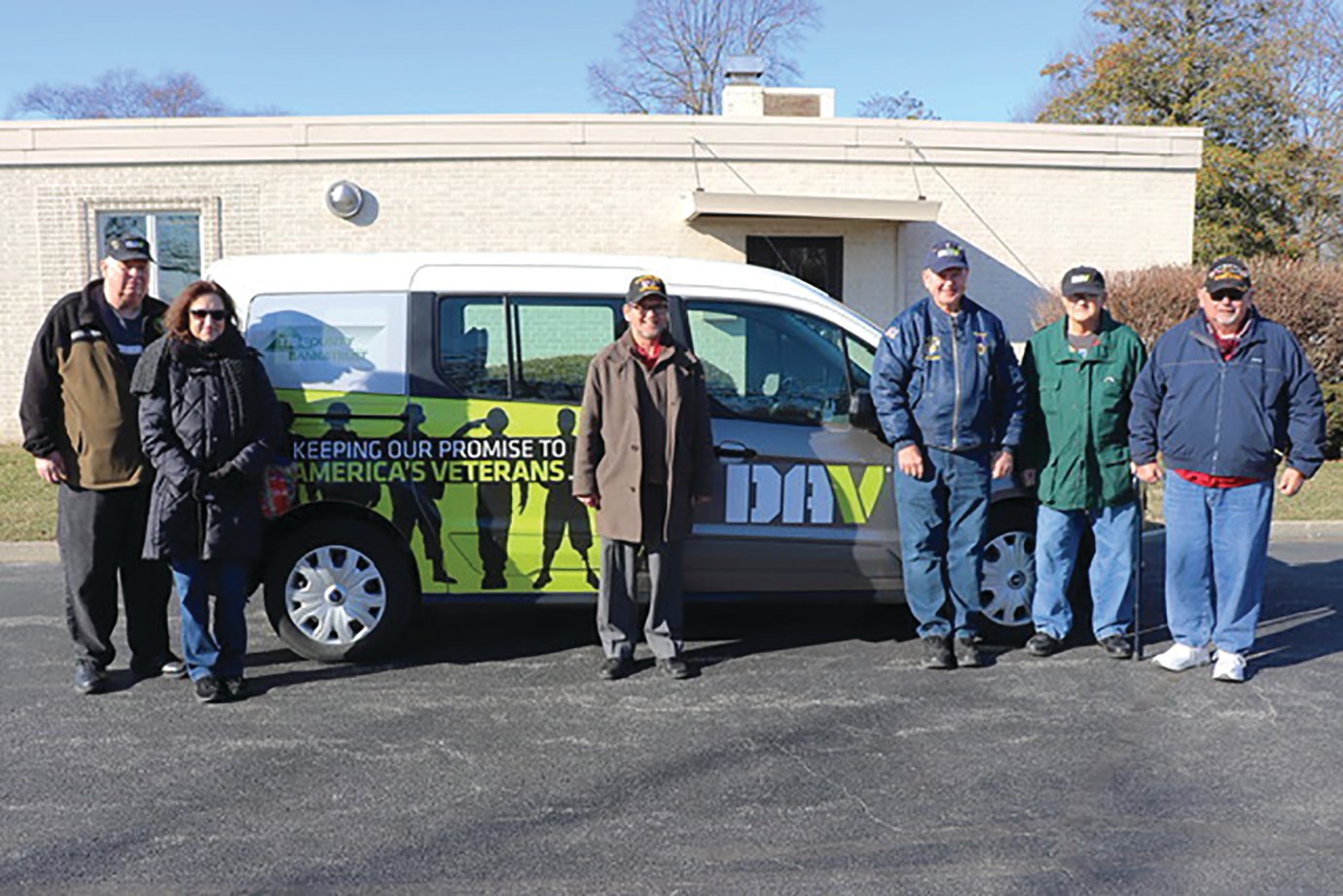 Veterans Service Officer of Montgomery County Joe Ellis, right, proudly accepts a new transport van destined to serve veterans in the county. The purchase was made possible by donations from Disabled American Veterans, Tri County Bank and Trust and Hoosier Heartland State Bank, as well as a grant from the Montgomery County Community Foundation.